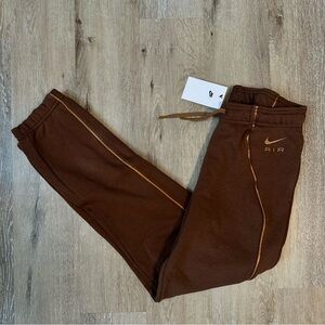 Nike Women's Brown Joggers with Gold Details